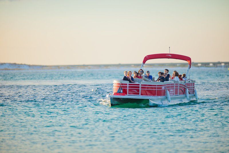 Large family on red 28ft Pontoon Boat Rental in Destin FL