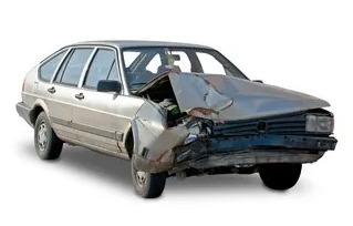 Severely damaged silver station wagon with a crushed front end on a white background