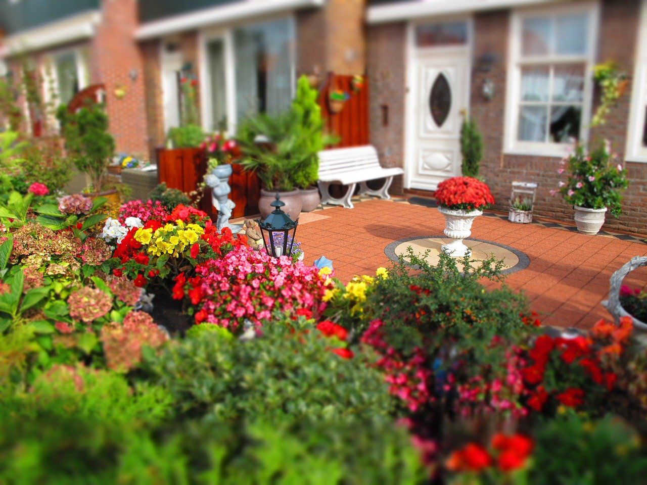 Brick patio, backyard apartment with flowers