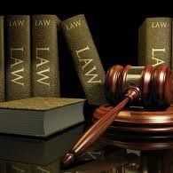 Law books and a gavel on a judge’s bench
