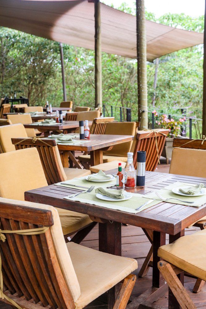 There are many tables and chairs in the restaurant.