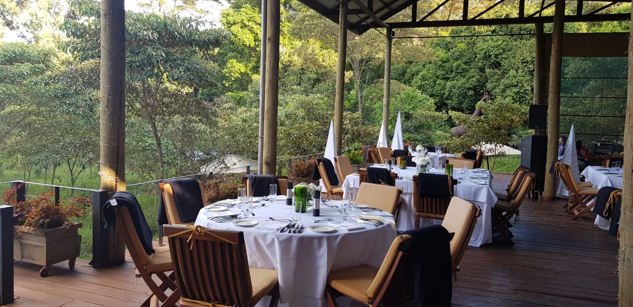 A patio with tables and chairs set up for an event.