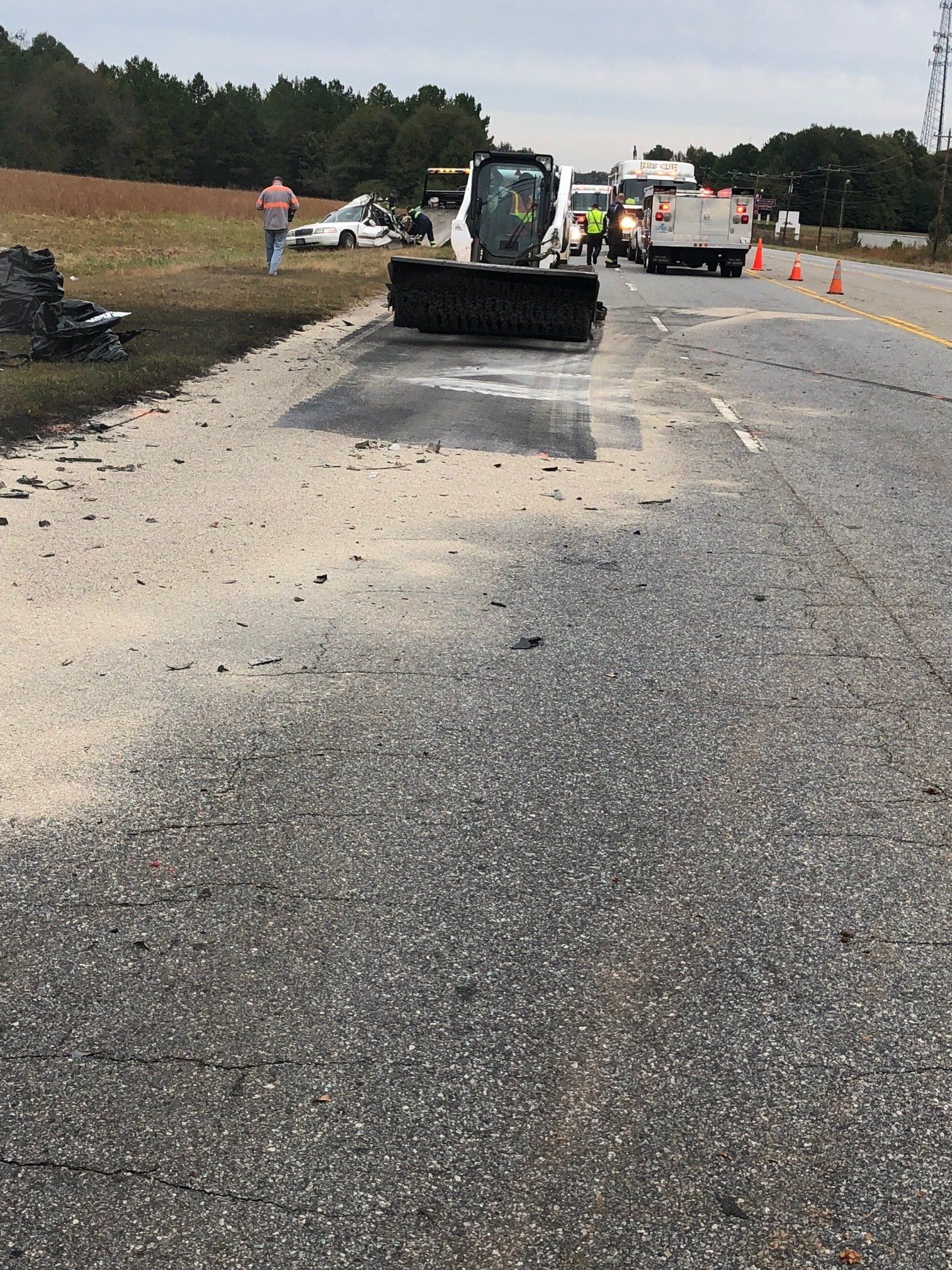 a bulldozer is working on the side of a road .
