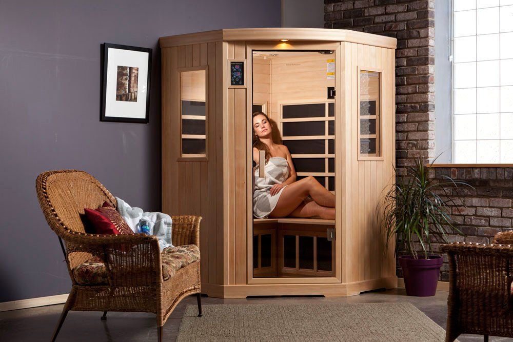 Woman relaxing in heat of the infrared sauna.