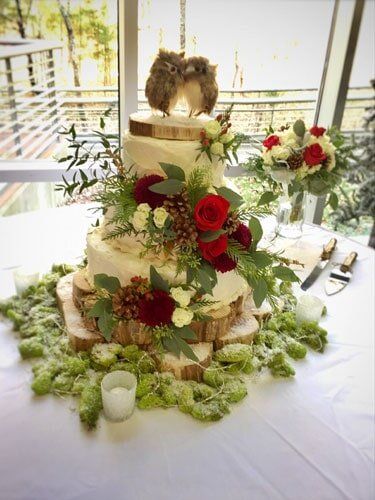 Wedding Arrangements — A Wedding Cake With Flowers in Ridgeland, MS