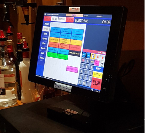 Young woman paying for cafe by credit card reader