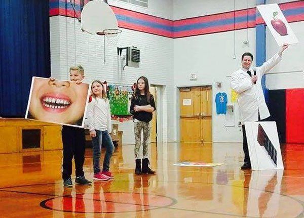 Edwardsville Family Dentist Dentist Dr. Moody at Woodland Elementary School in Edwardsville assembly