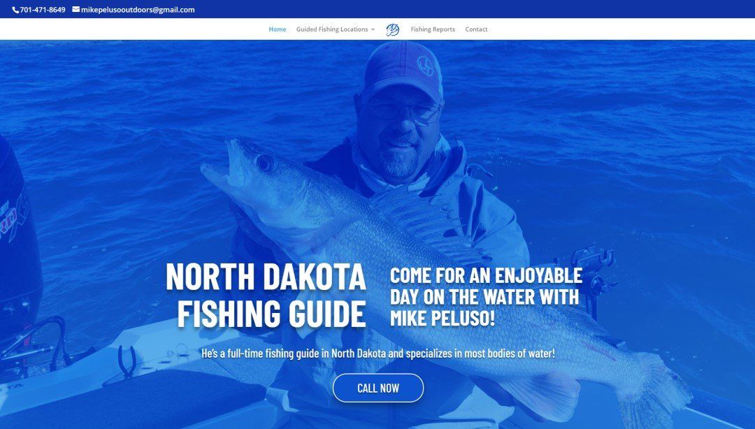 A man is holding a fish in a boat on the north dakota fishing guide website.