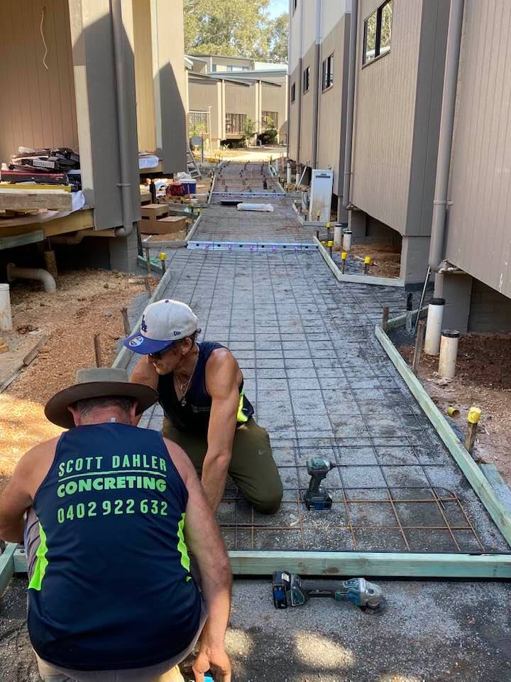 Two Men Working On A Concrete Slab — Concreters in Port Macquarie, NSW