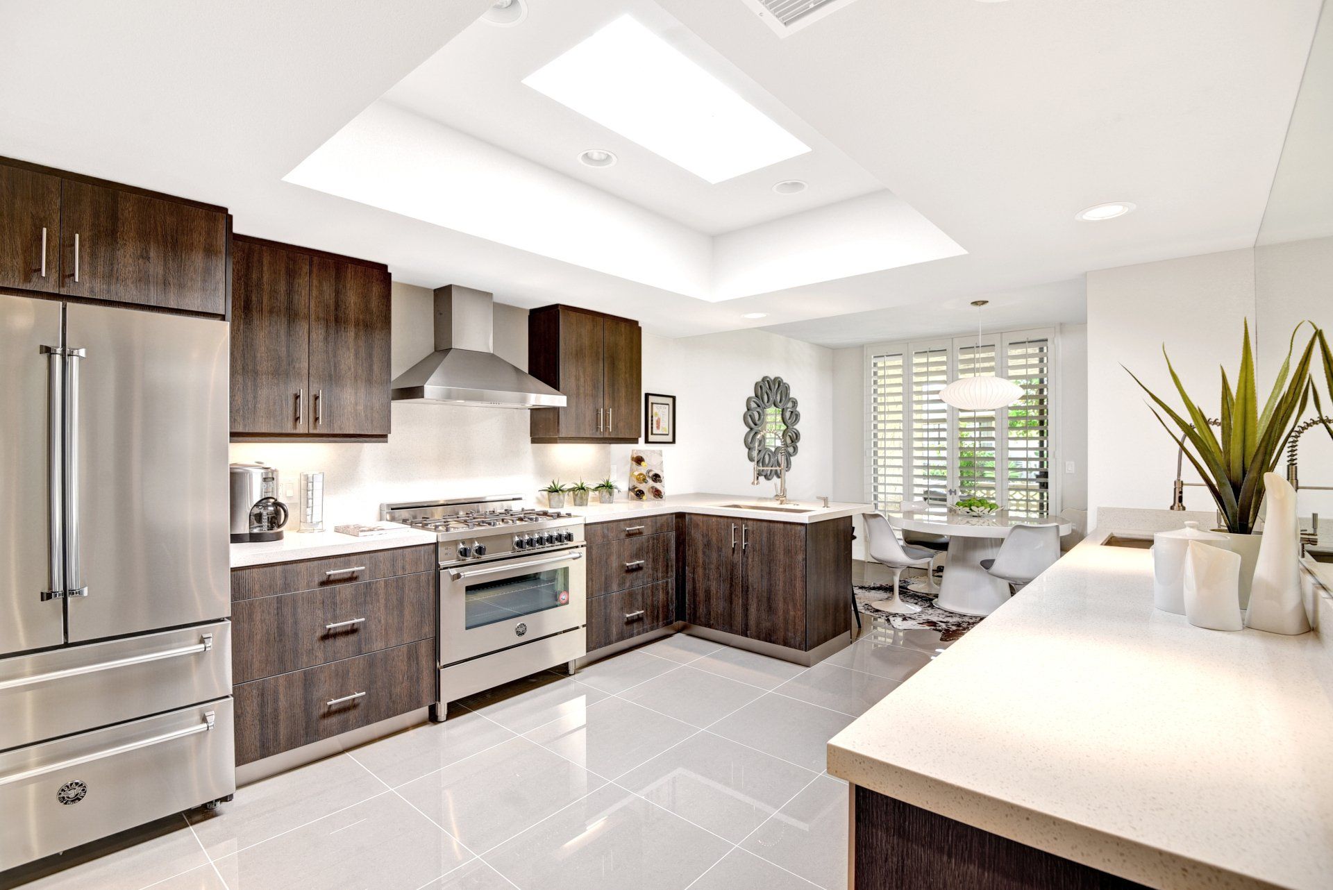 A kitchen with stainless steel appliances and wooden cabinets