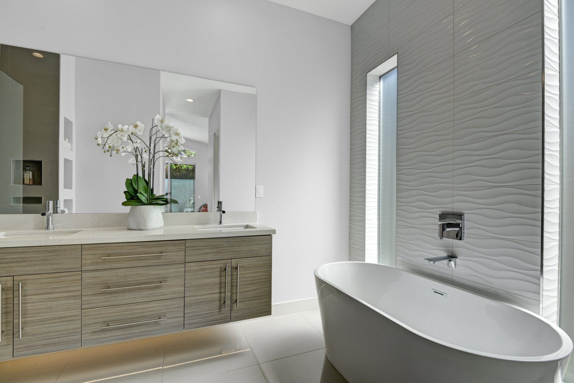 A bathroom with a bathtub , sinks , and mirrors.