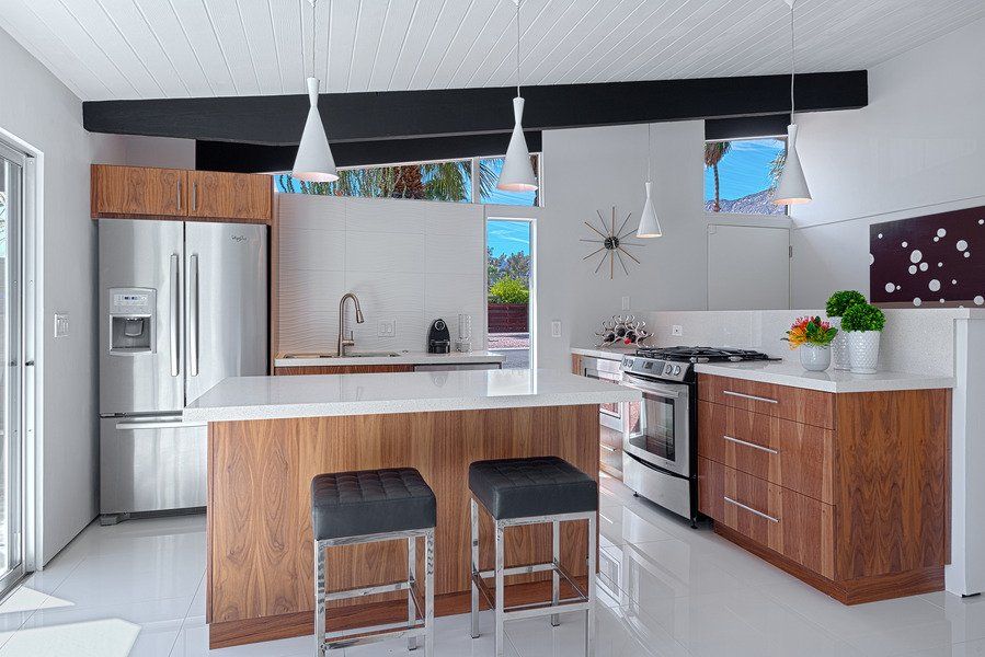 A kitchen with stainless steel appliances and wooden cabinets