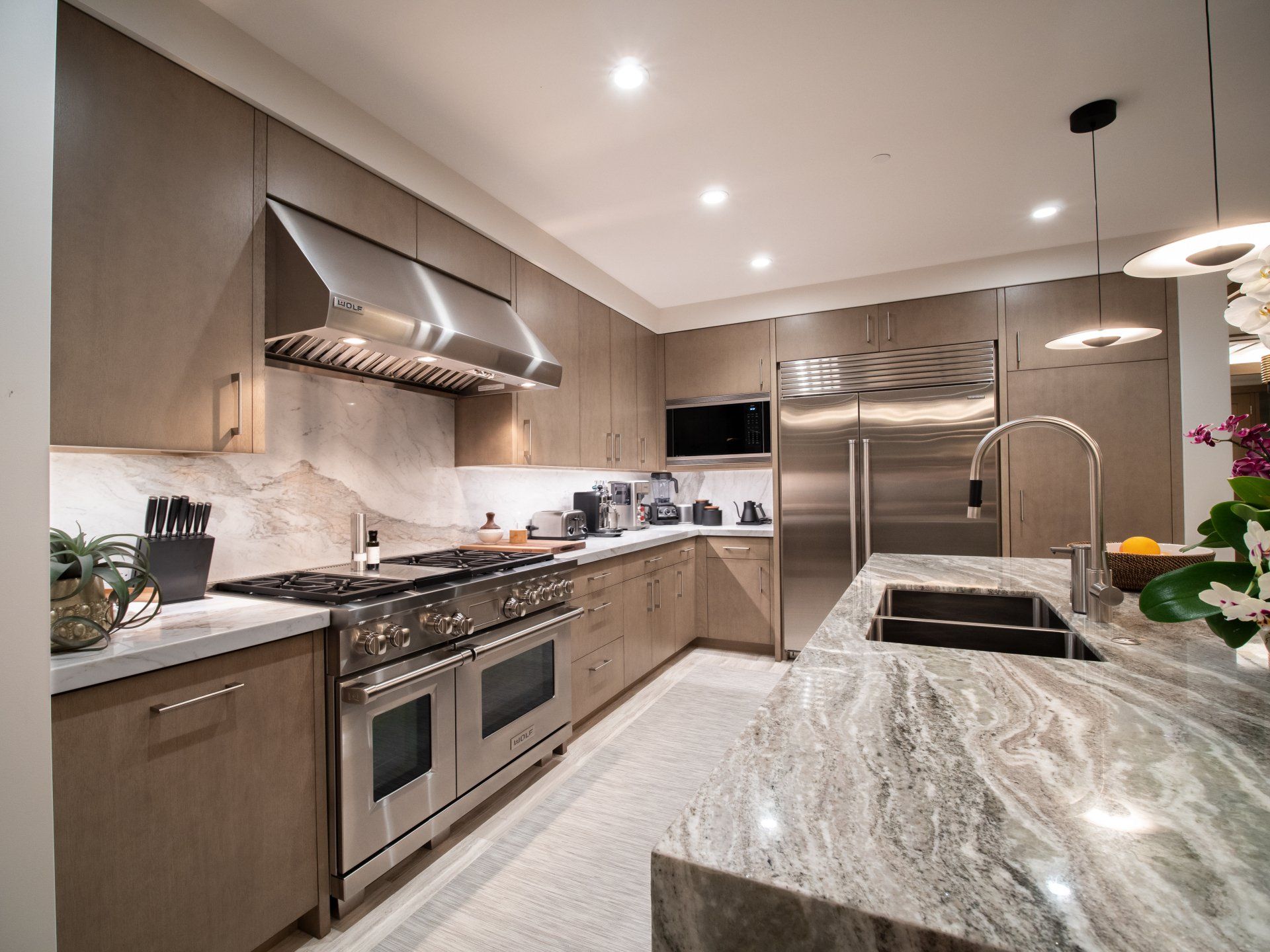 A kitchen with stainless steel appliances and granite counter tops