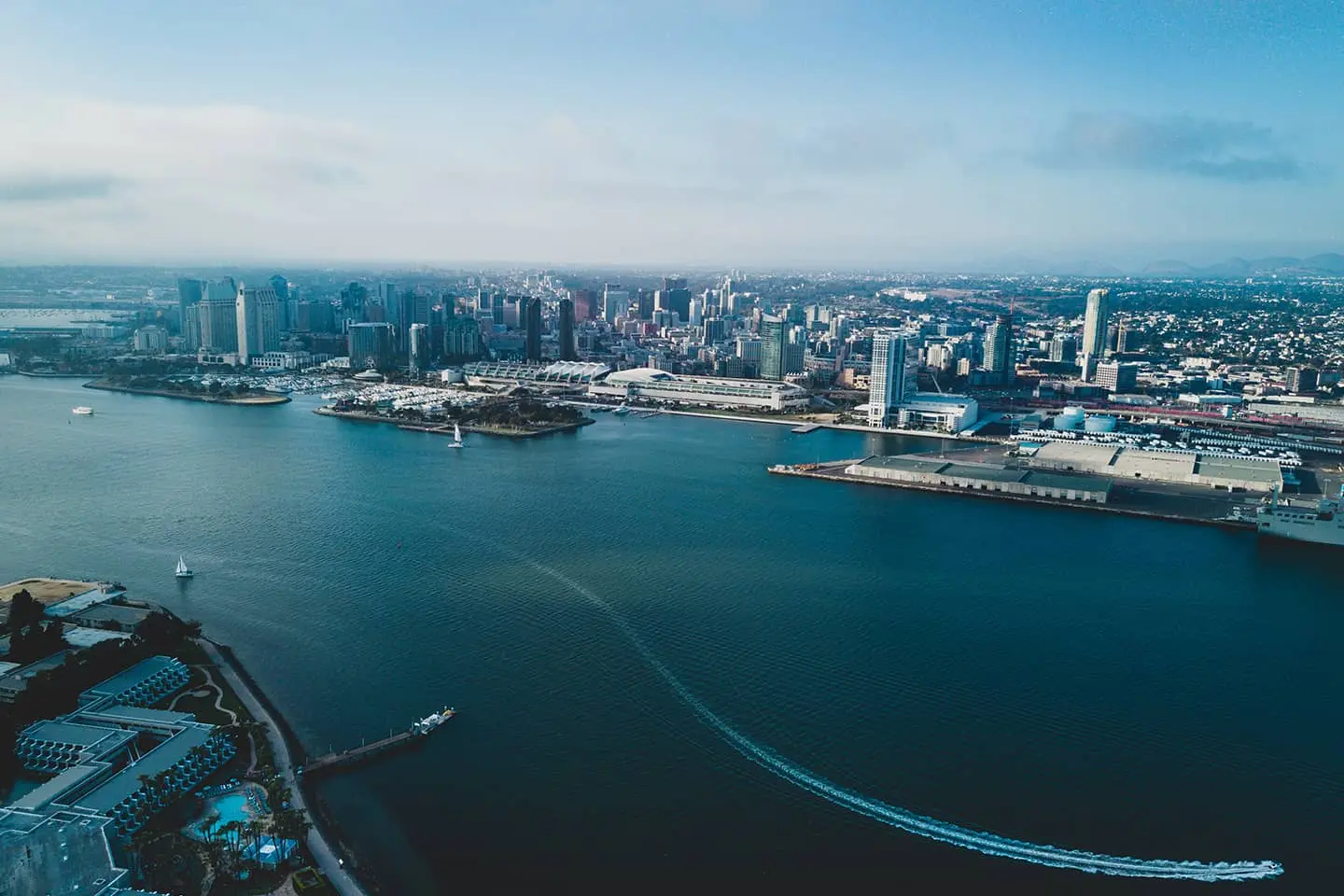 An aerial view of a city and a body of water.