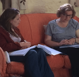Two ladies working on their lessons