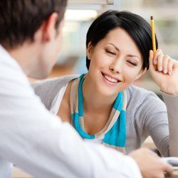 a young woman learning from a tutor