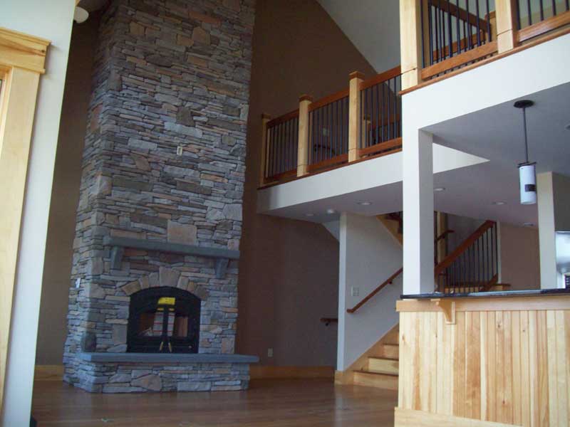 Tall stone fireplace construction
