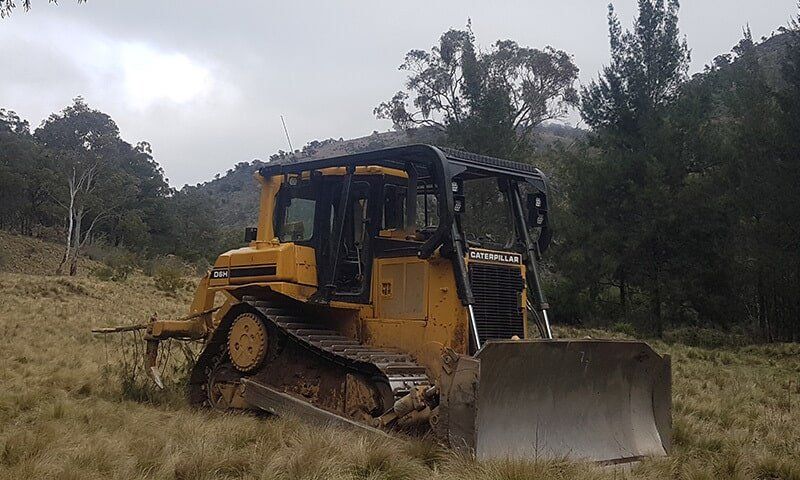 Mini Yellow Bobcat — C & E Earthmoving in Moss Vale, NSW