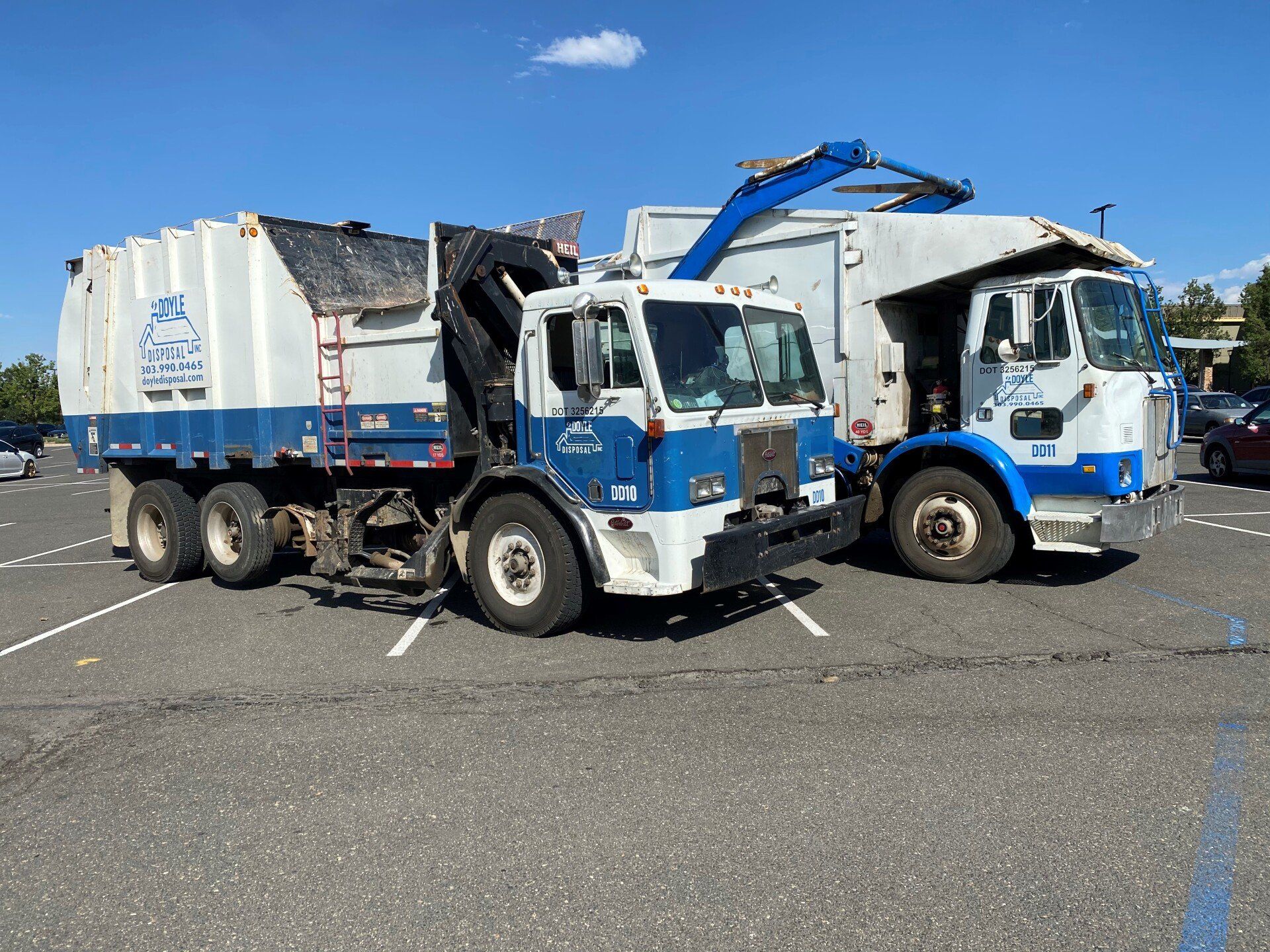 Garbage Truck Picking Up the Trash — Dumont, CO — Doyle Disposal Garbage Truck Picking Up the Trash — Dumont, CO — Doyle Disposal
