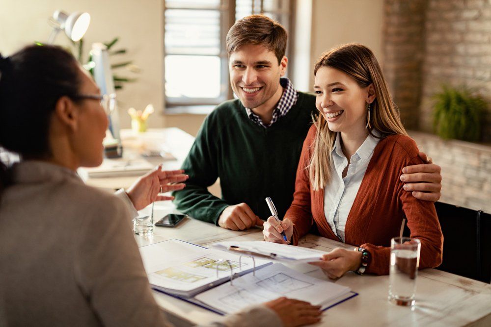 Couple Signing insurance Paper — Kent, OH — Gimbel Agency LLC