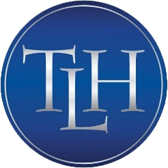 Blue circular logo with silver letters 