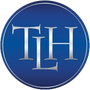 Blue circular logo with silver letters 