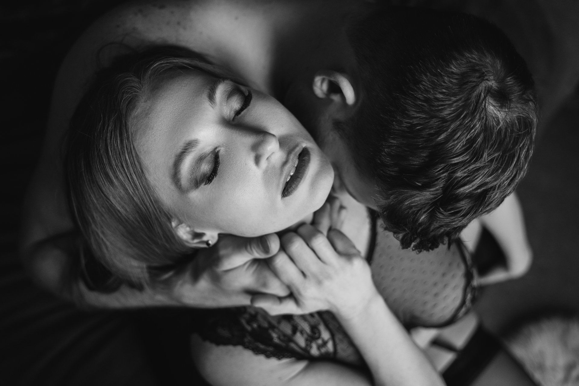 couples photo shoot man kissing woman's neck