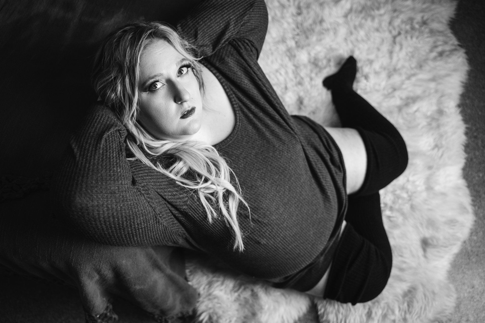 woman sitting on floor looking up