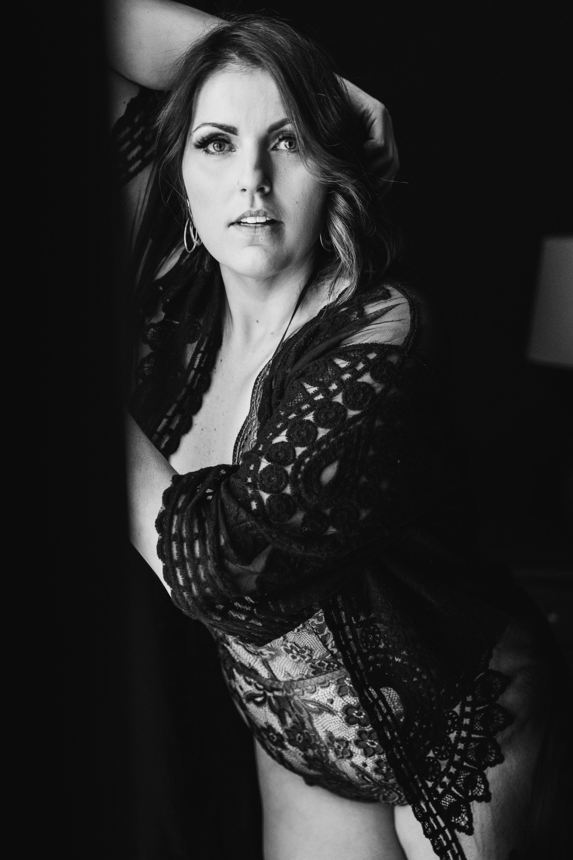 boudoir image of woman by window