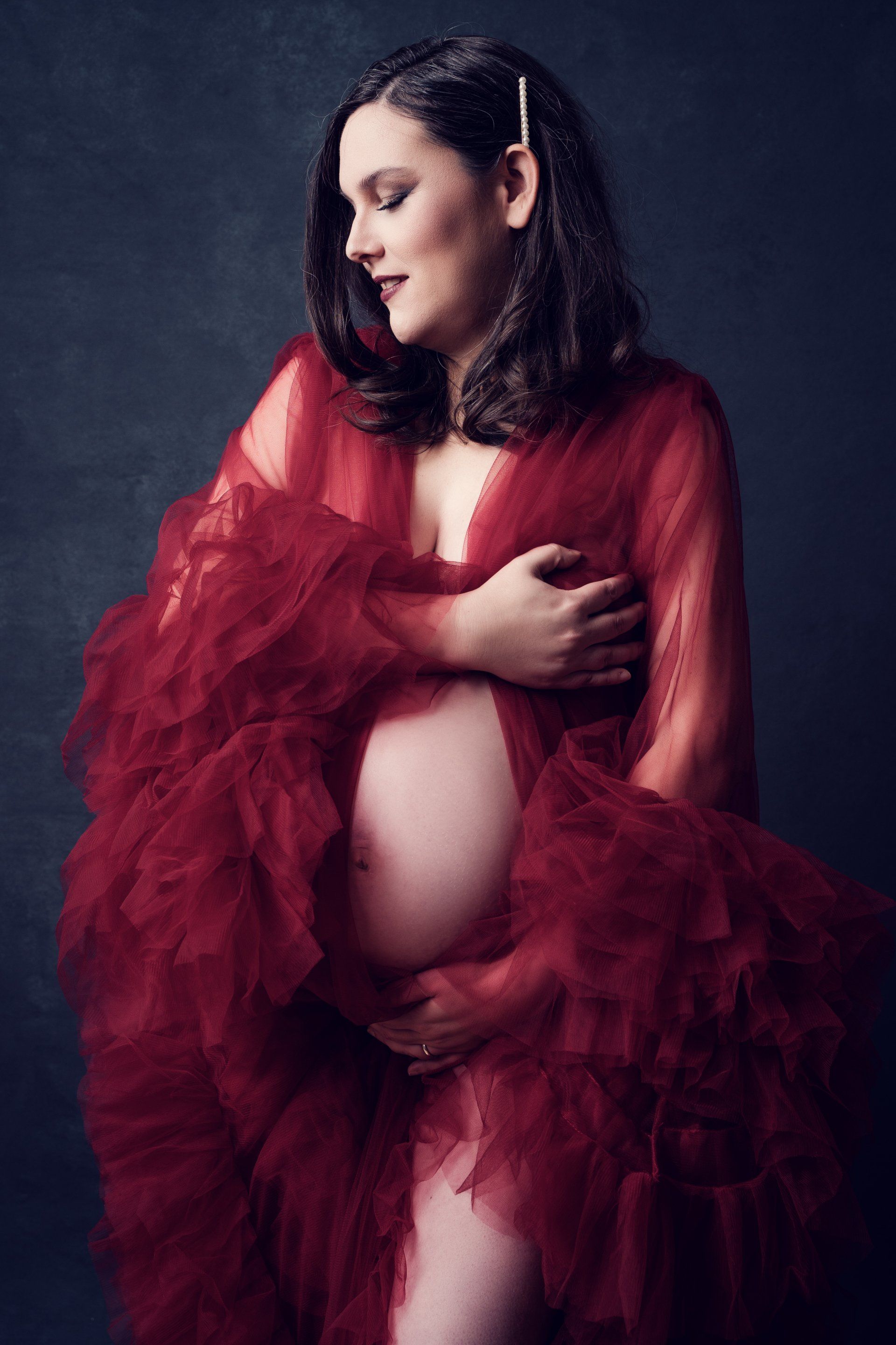 maternity shoot woman in red robe