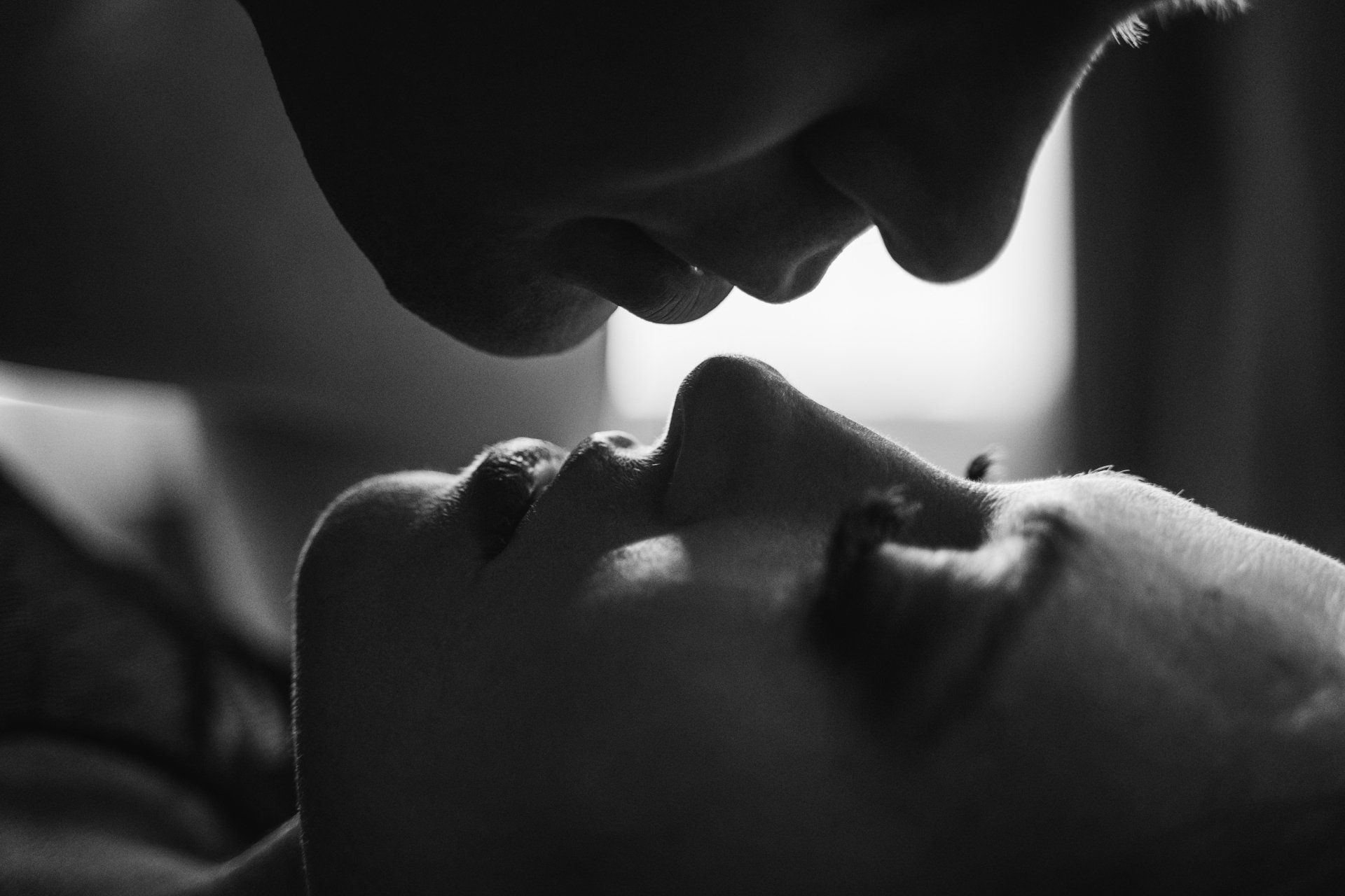 man and woman with faces close together