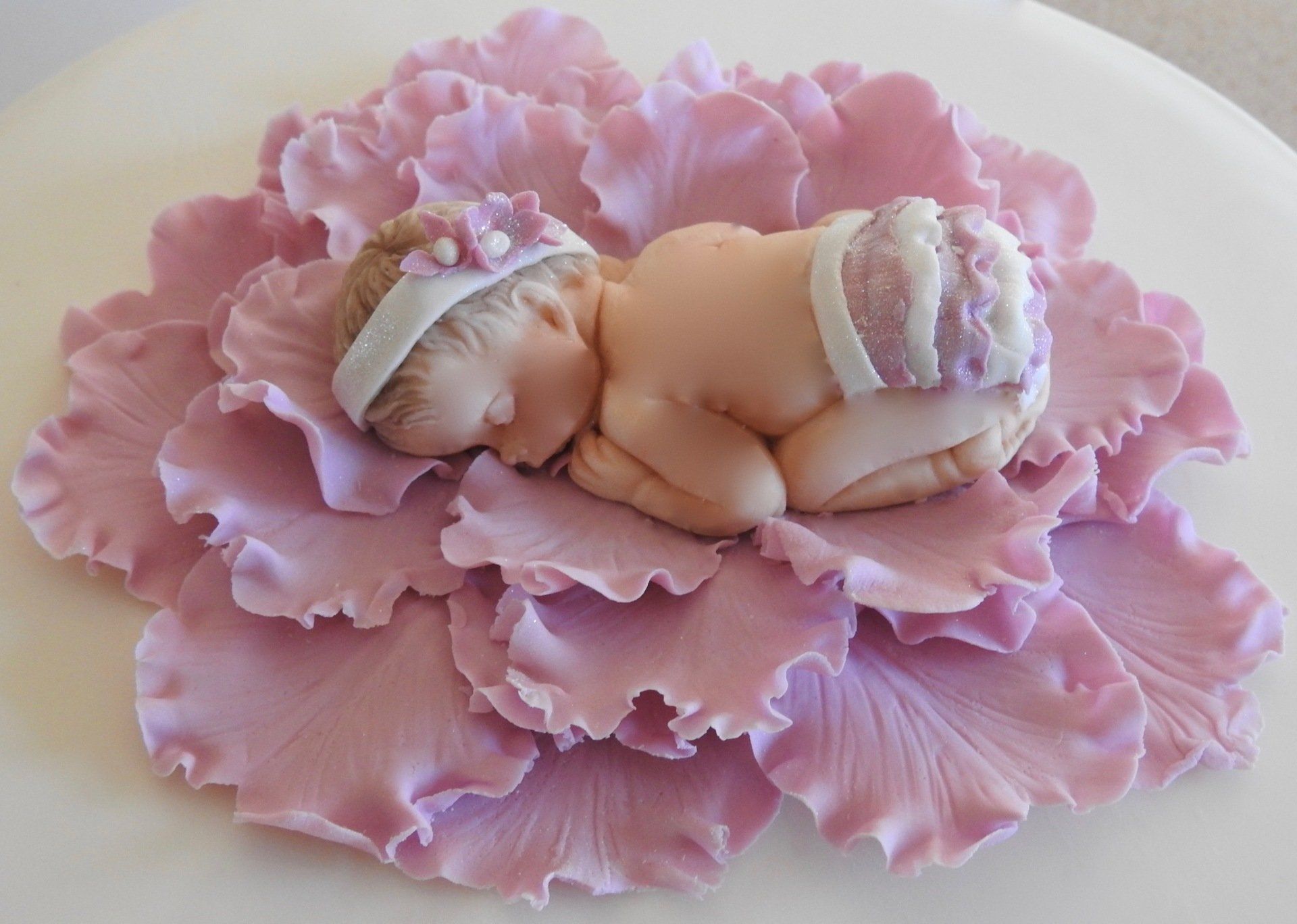 Cute Pink Baby Girl Cake Topper Baby sleeping in a pink flower.