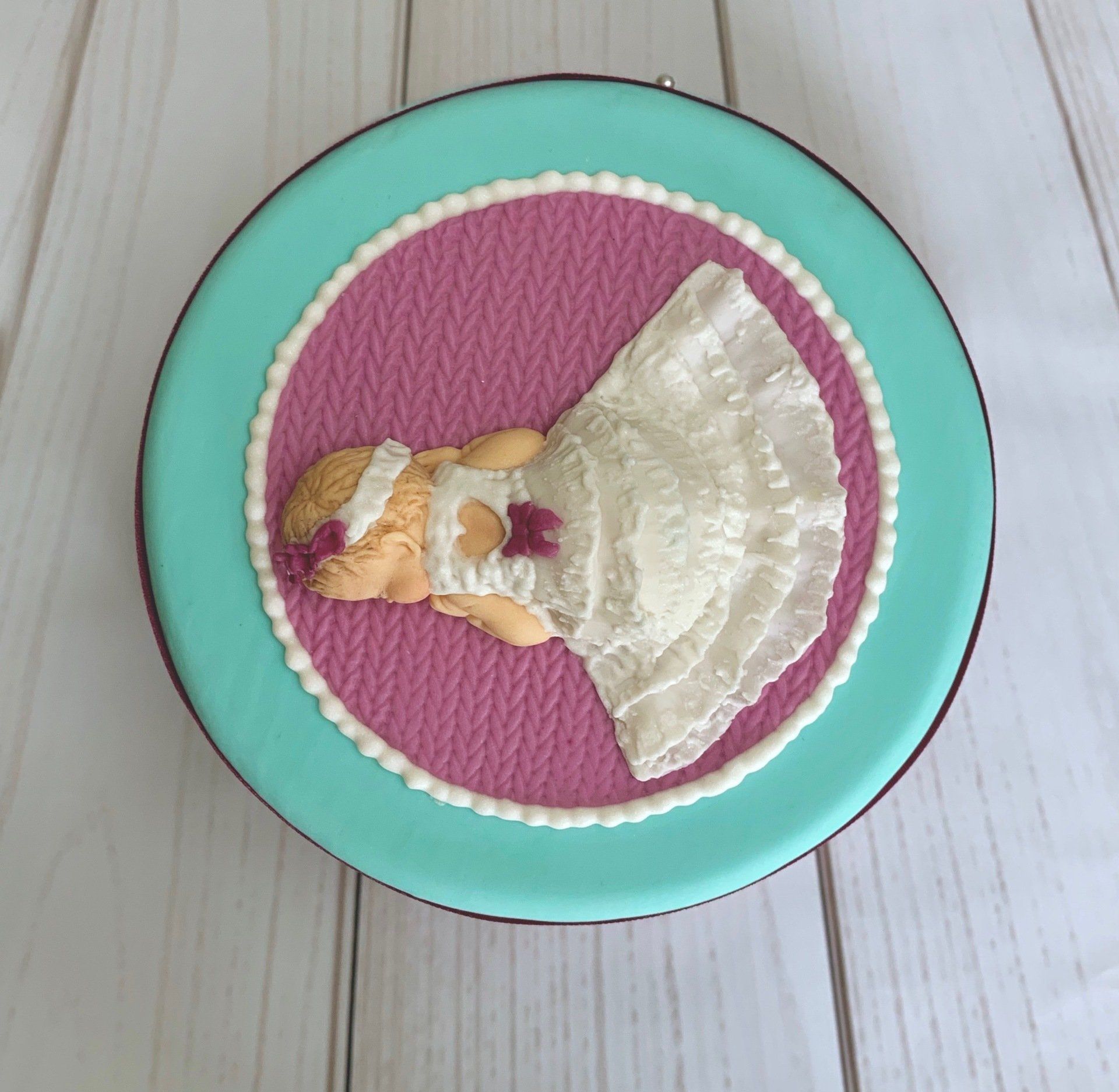 Top View - Christening Cake with hand sculpted fondant baby in a fondant christening gown