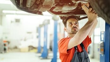 Man Repairing Car — auto repair in Cinnaminson, NJ Man Repairing Car — auto repair in Cinnaminson, NJ