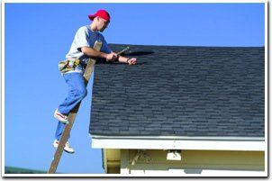 Man repairing roof Man repairing roof