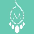 Home Logo A white necklace with the letter m on it