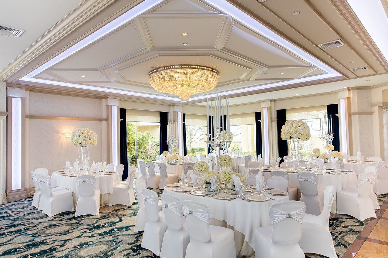 All White Guest Tables at Wedding Venue