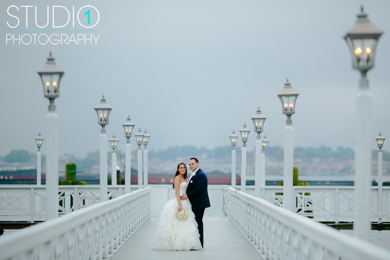 Groom Embracing Bride on Dock