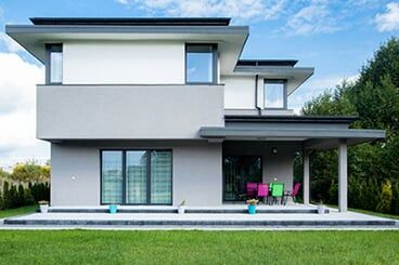 Modern house with patio and garden