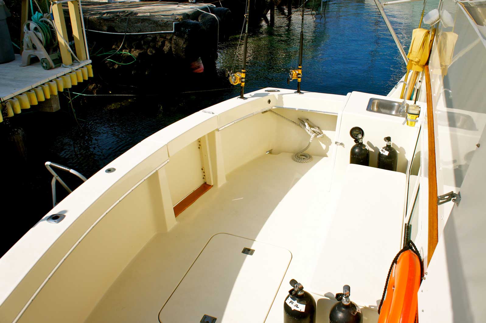 The front of a boat with a life preserver hanging from it