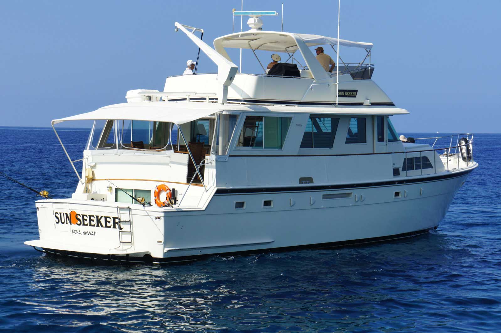 A white boat with the name skyseeker on the back