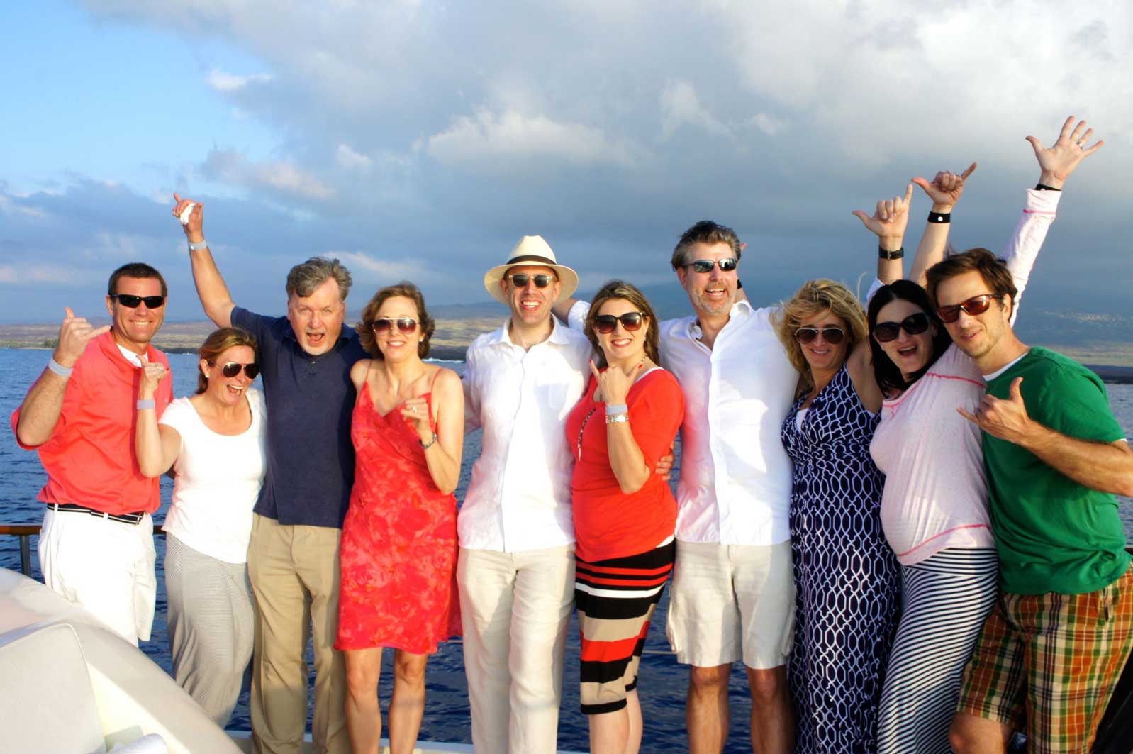 A group of people posing for a picture on a boat