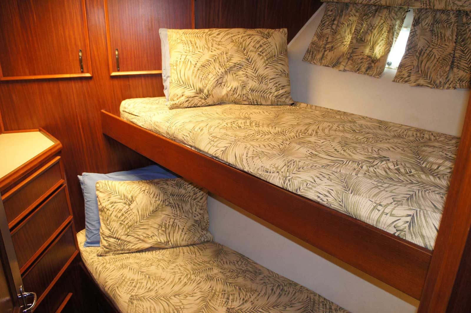 A bunk bed with two beds on a boat.