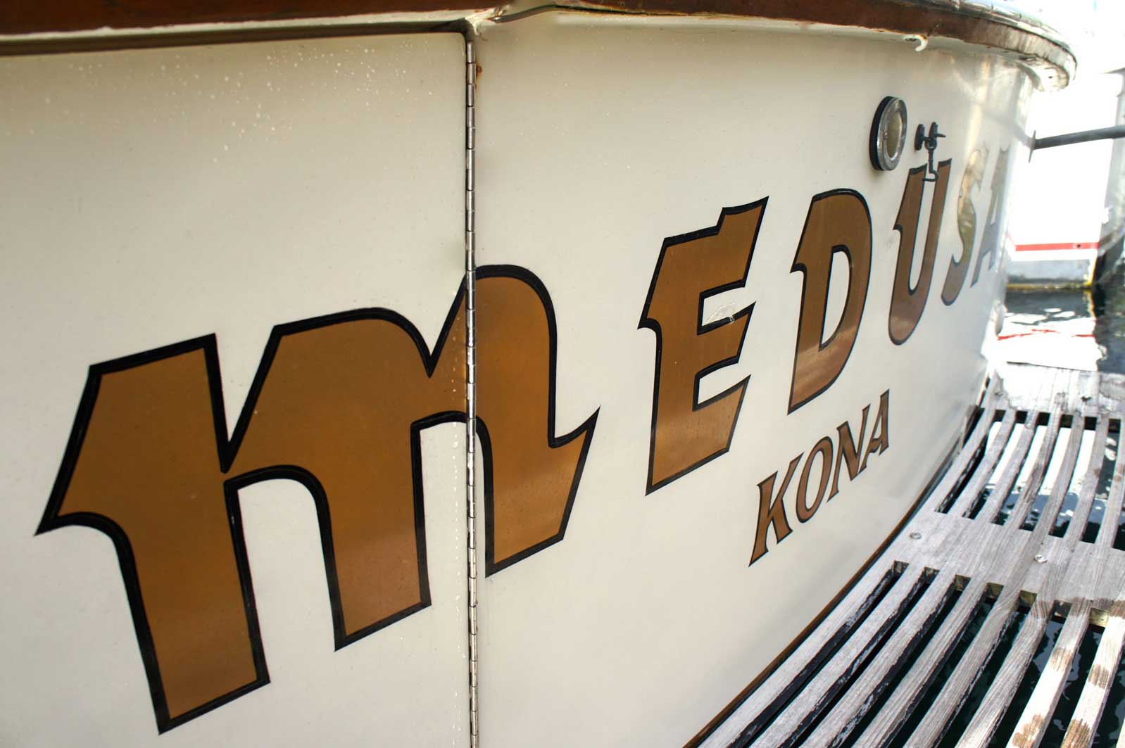 The word medusa is on the side of a boat