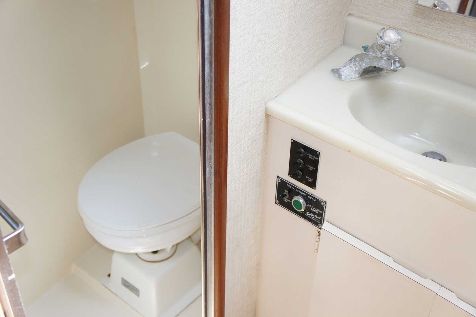 A bathroom with a toilet and a sink in it