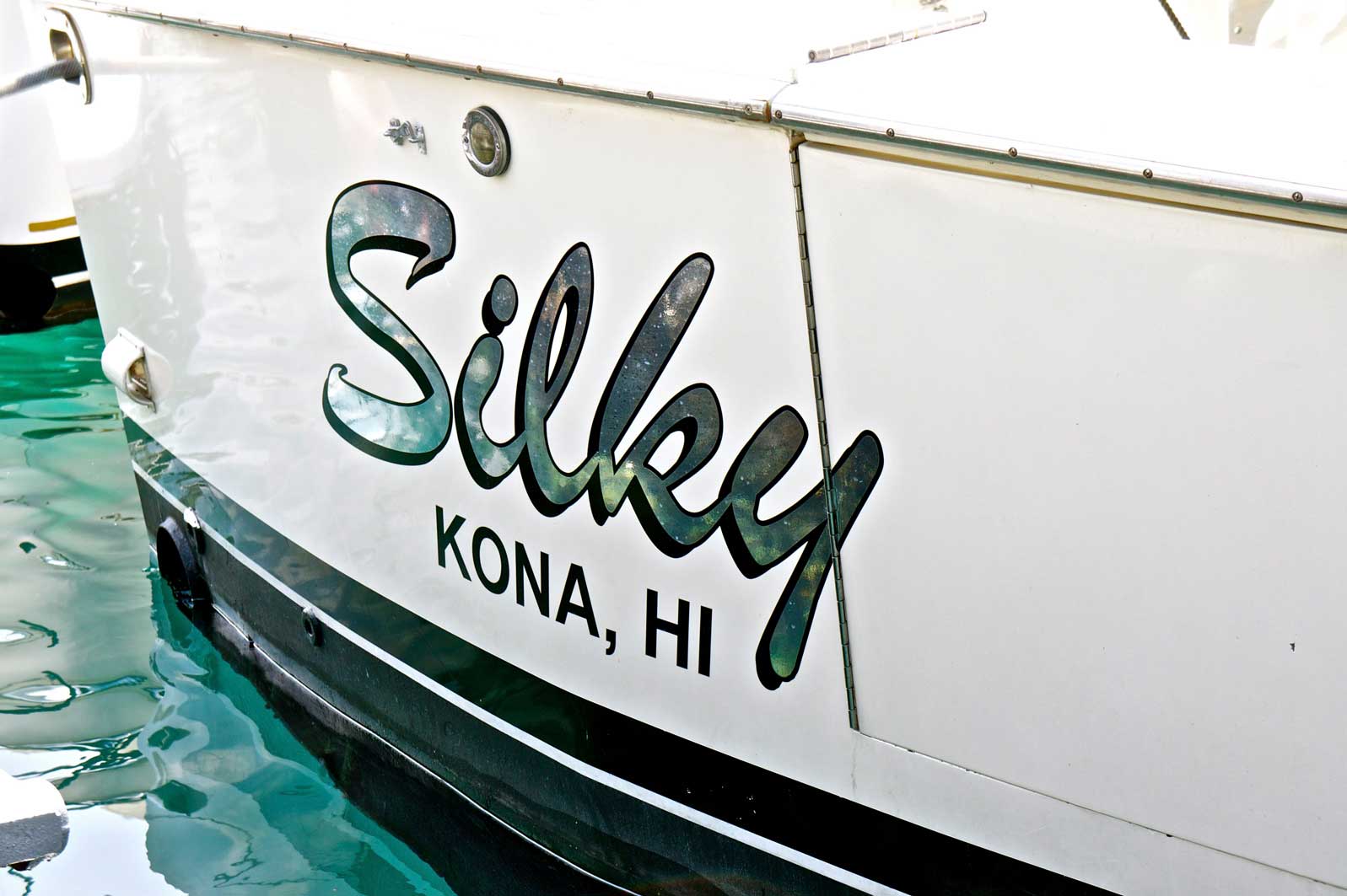 The name silky is on the side of a boat