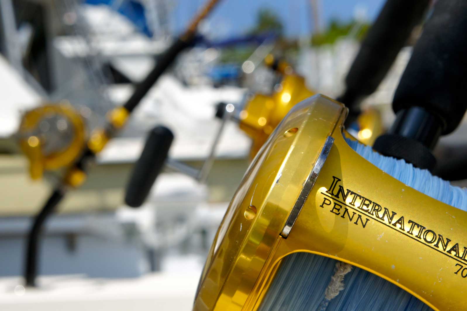 A close up of a penn fishing reel on a boat