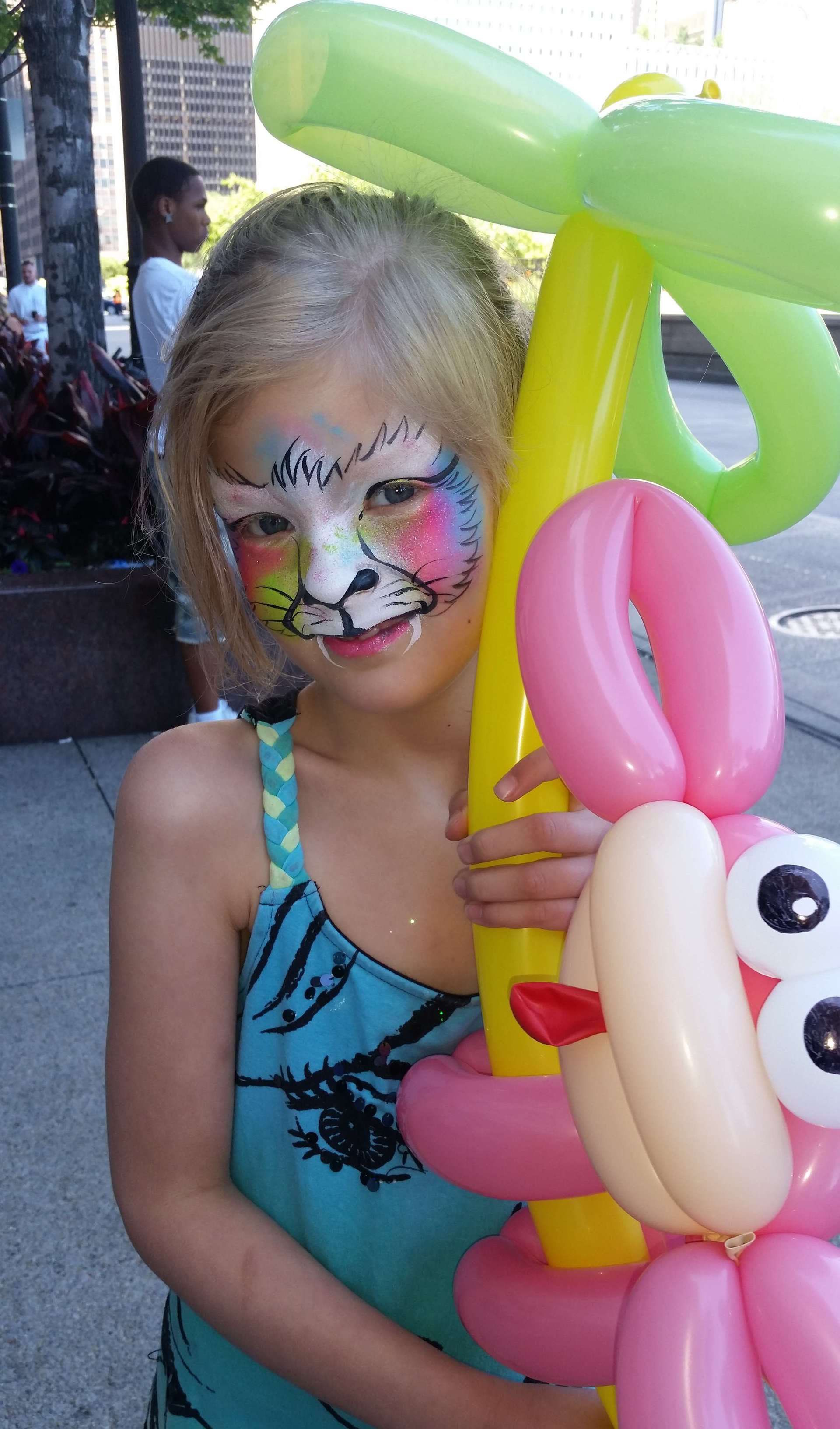 Chicago face painting rainbow tiger design.
