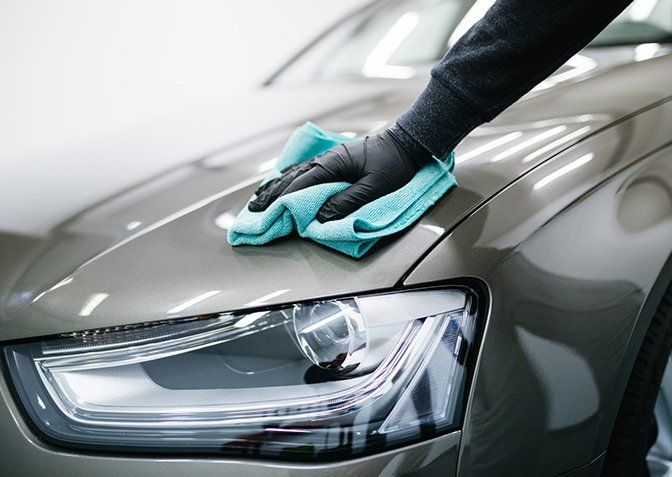 Man Cleaning Car with Microfiber Cloth — Terry Austin’s Crash Repairs in Toowoomba, QLD Man Cleaning Car with Microfiber Cloth — Terry Austin’s Crash Repairs in Toowoomba, QLD