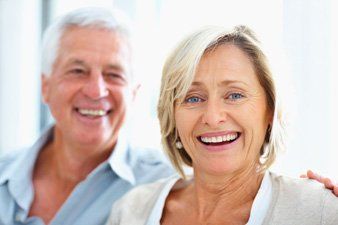 wife and husband smiling